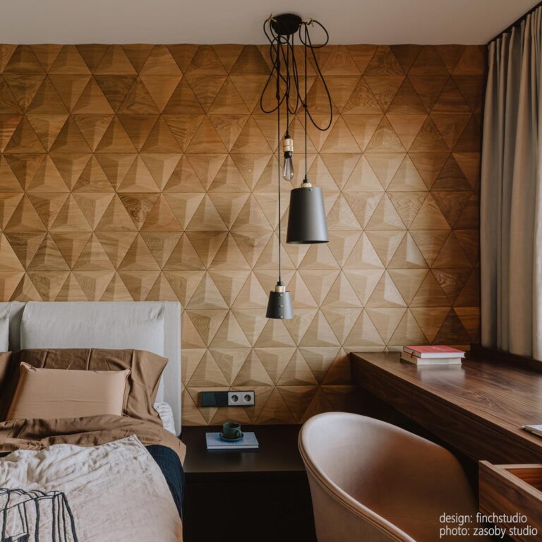 Cosy bedroom with wooden wall panels used as a warm and textured headboard backdrop