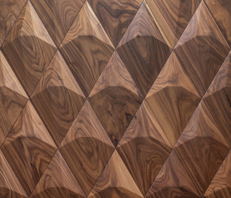 Elegant TV wall with walnut 3D wall panels arranged in a sculptural pattern