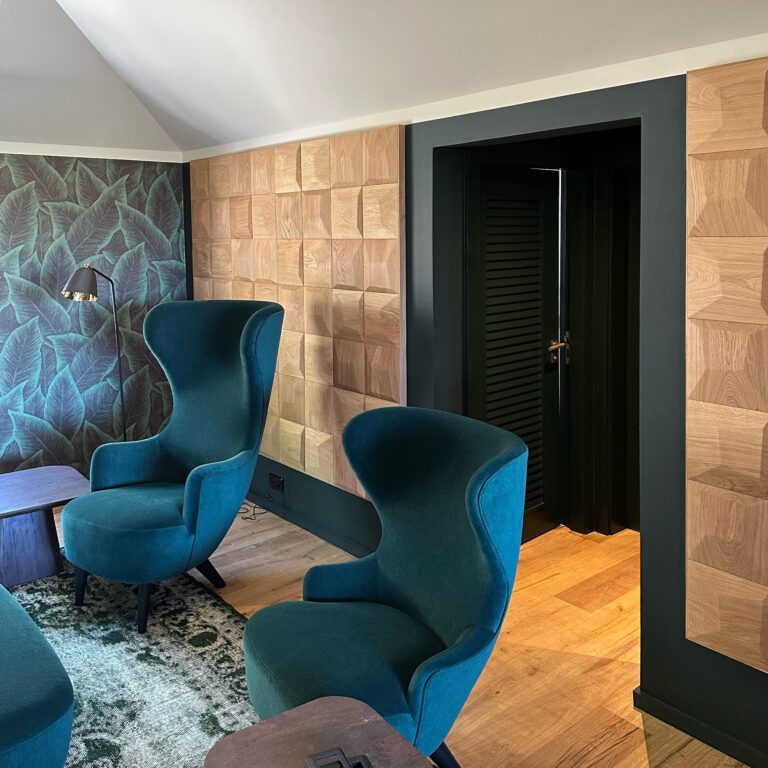 Wood wall panelling behind couch in cozy living room