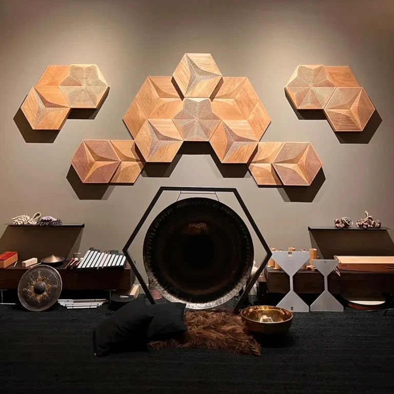 Wooden wall art installation above modern console table