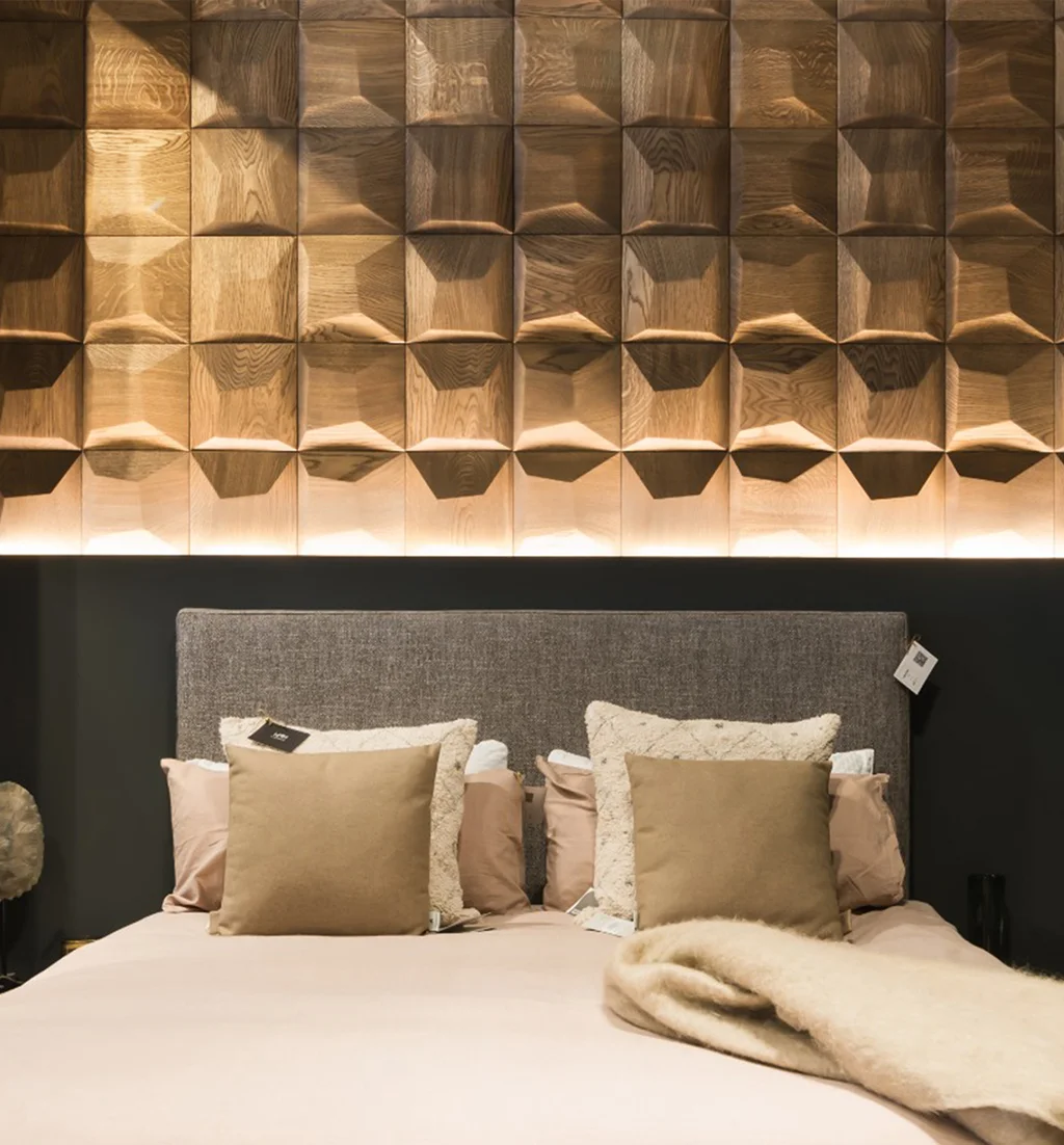 Luxury bedroom featuring a decorative 3D oak wood panel wall with a square pattern and linear accent lighting.